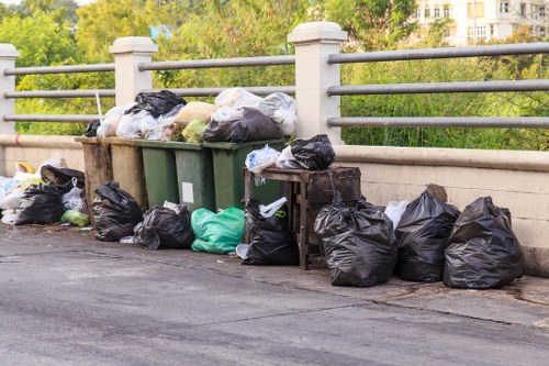 Business professionals discussing skip hire options in Tottenham