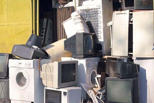 Emergency spill kit and first-aid equipment beside a skip